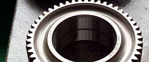 Precision ground helical gears on an inspection table — gears for crane hoisting and travel mechanisms
